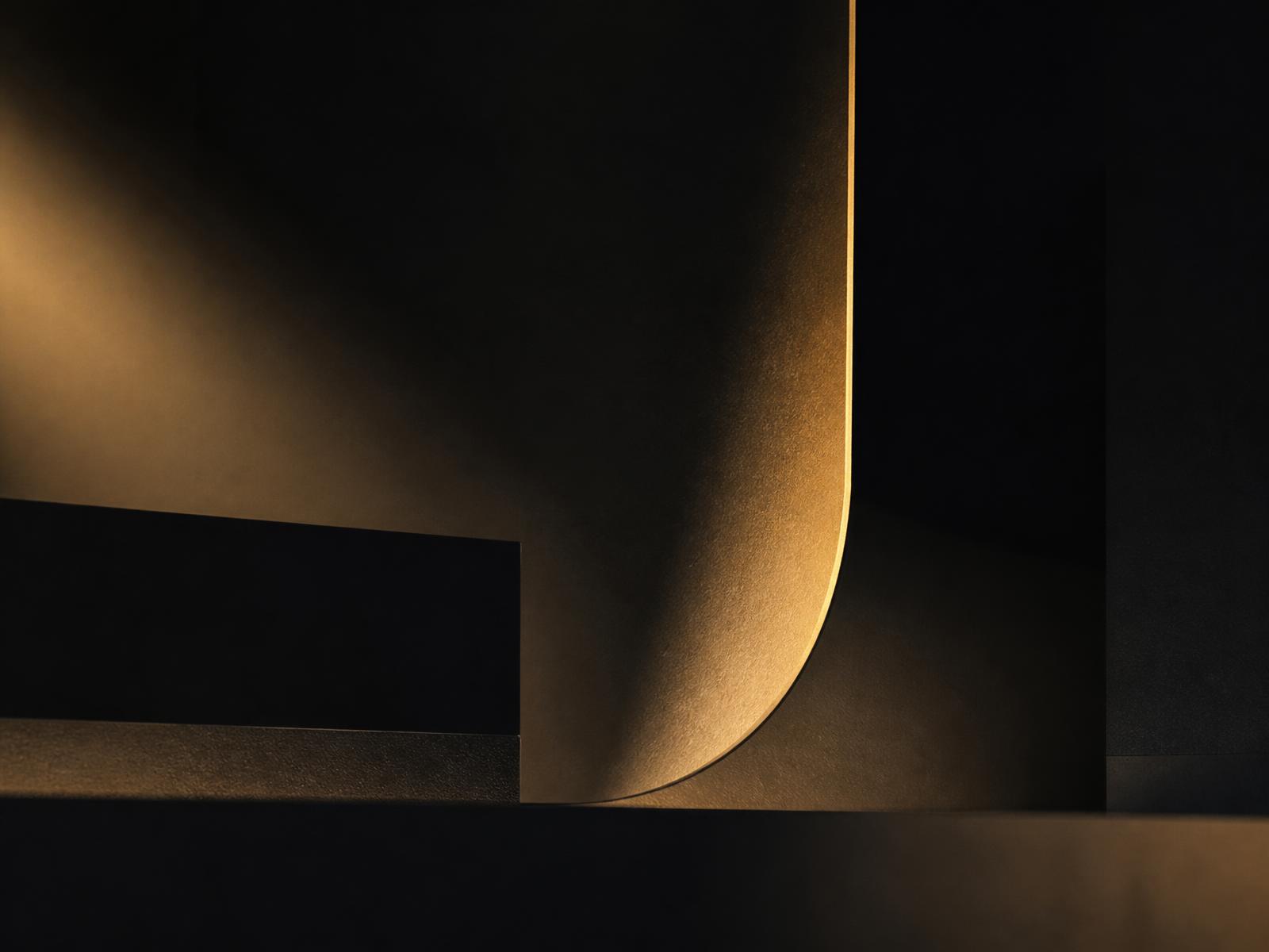 Dark textured backdrop with warm gold light, representing Kandel and Co.